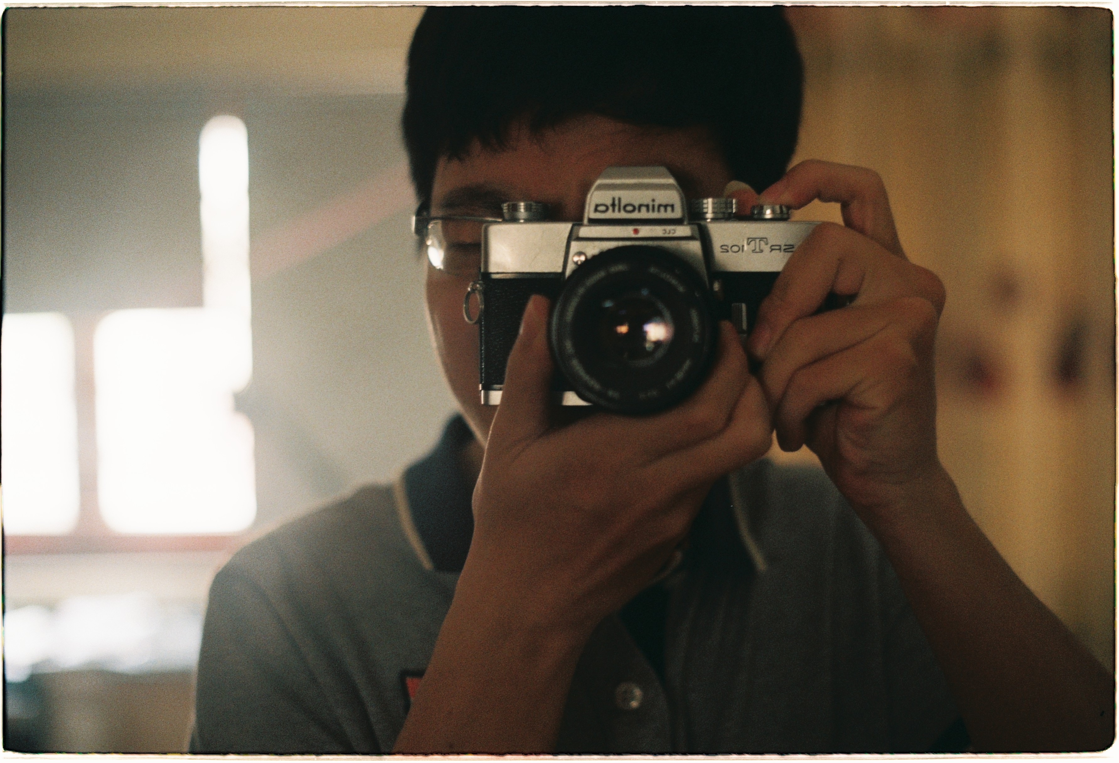 Self-portrait with Minolta SRT-102